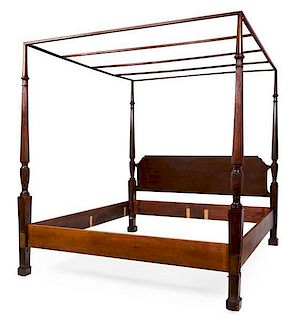 An English Carved Mahogany Four-Poster Bed Height 87 1/2 x width 82 x depth 82 inches.