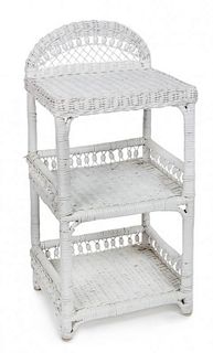 A White Wicker Stand Height 27 1/4 x width 15 1/4 x depth 12 inches.