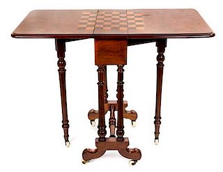 A Late Victorian Walnut Games Table Height 27 1/2 x width 34 1/4 x depth 18 inches.