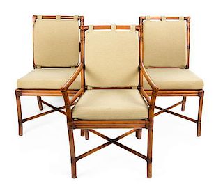 A Set of Twelve Rattan Dining Chairs Height 34 inches.