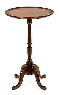 A Georgian Style Mahogany Tripod Table Height 25 1/4 x diameter 15 inches.