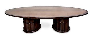 An Art Deco Style Palisander and Satinwood Pedestal Dining Table Height 29 x width 124 x depth 70 inches.