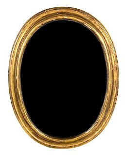 A Giltwood Oval Mirror 52 x 40 inches.