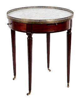 A Louis XVI Style Mahogany Bouillotte Table Height 30 x diameter 25 3/4 inches.