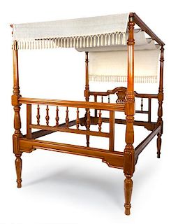 A Colonial Style Walnut Four-Post Bed Height 91 x width 60 inches.