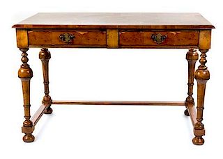 A William and Mary Style Walnut and Yew Wood Writing Table Height 31 x width 47 x depth 25 inches.
