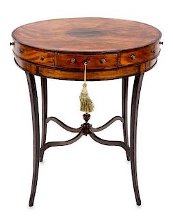 A George III Satinwood and Mahogany Circular Center Table Height 29 x diameter 26 inches.
