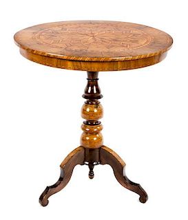 An Italian Walnut and Parquetry and Occasional Table Height 29 3/4 x diameter 27 1/2 inches.
