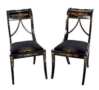 A Pair of Regency Ebonized and Parcel-Gilt Side Chairs Height 33 inches.