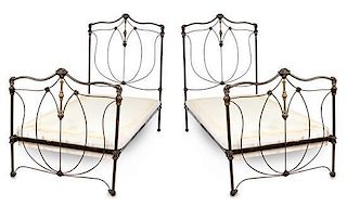 A Pair of Victorian Style Patinated Iron and Brass Twin Bedsteads Width 39 inches.
