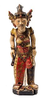 An Indonesian Carved and Painted Figure of Priest Height 25 inches.