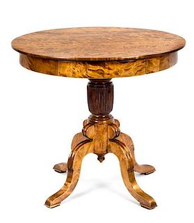 A Burr Maple Occasional Table Height 29 1/1 x diameter 32 inches.