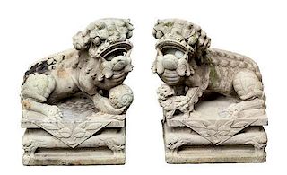 A Pair of Chinese Stone Composite Figures of Foo Lions Height 21 inches.