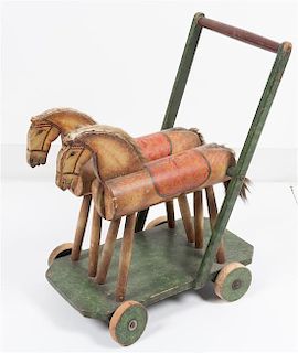 A Victorian Style Child's Push Cart Height 19 1/2 x width 15 inches.