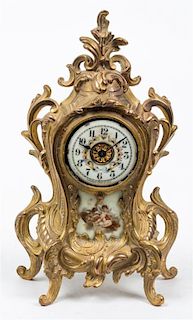 A Louis XVI Style Porcelain Inset Mantel Clock Height 11 1/4 inches.