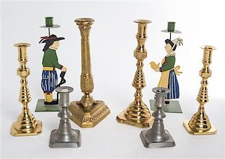 * A Group of Eight Candlesticks Height of tallest 12 inches.