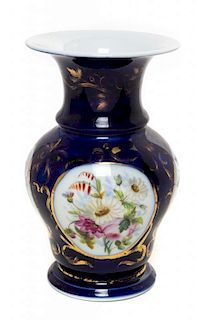 * A Continental Porcelain Vase Height 10 1/2 inches.