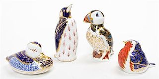 * A Collection of Royal Crown Derby Porcelain Figural Paperweights Height of tallest 5 1/4 inches.