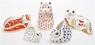 * A Collection of Royal Crown Derby Porcelain Figural Paperweights Height of tallest 5 1/4 inches.