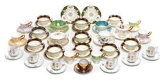 * A Collection of Porcelain Tea Cups Width of widest 3 1/2 inches.