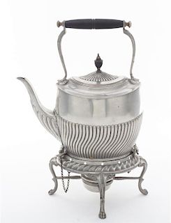 An English Pewter Kettle on Lampstand Height overall 13 1/4 inches.