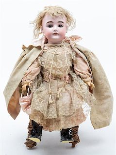 * A German Bisque Headed Doll, Kestner Height of doll 22 inches.