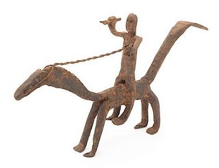 * An Ethnographic Cast Metal Figure Width 15 3/4 inches.
