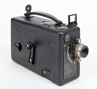 * A Cine-Kodak Camera. Length 8 1/2 inches.