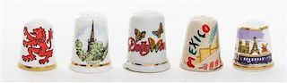 A Collection of Five Souvenir Thimbles Height 1 1/8 inches.