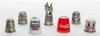 A Collection of Seven Americana Themed Thimbles Height of tallest 1 7/8 inches.