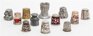 A Collection of Silver and Metal Thimbles Height of tallest 1 1/4 inches.