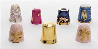 A Collection of Gilt Decorated Porcelain Thimbles Height of tallest 1 inch.