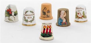 A Collection of Holiday Themed Thimbles Height of tallest 1 inch.