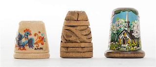 A Collection of Three Wood Thimbles Height of tallest 1 1/8 inches.