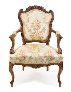 A Victorian Walnut Fauteuil Height 36 inches.