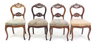 * A Set of Four Victorian Walnut Chairs Height 33 1/2 inches.