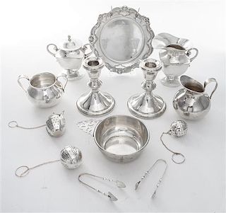 * A Collection of American Silver Articles, Various Makers, comprising three tea strainers, a saucer, two sugar tongs, two sugar