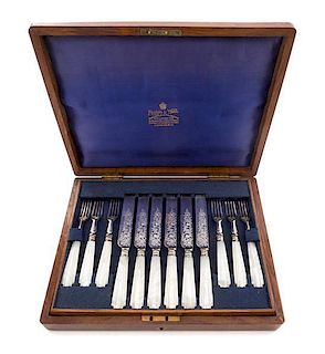 An English Silver-plate Dessert Service, retailed by Mappin & Webb, London, comprising 12 knives and 12 forks, each with mother-