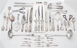 * An Assortment of Silver and Silver-plate Flatware Length of longest 14 inches.