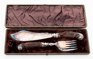 * A Victorian Silver-plate Antler Handled Carving Set Length of first knife 13 1/4 inches.