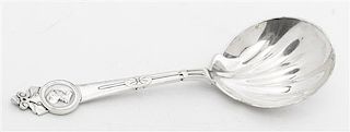 * A Silver Serving Spoon, Tiffany & Co., New York, NY, in the Medallion pattern.