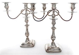* A Pair of English Silver-plate Three-Light Candelabra, , the baluster form stems supporting two scrolling branches.