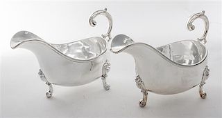 * A Pair of English Silver-plate Sauce Boats, Elkington & Co., Birmingham, 20th Century, of typical boat form raised on three sc