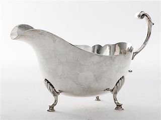 * An American Silver Sauce Boat, Revere Silversmiths, Brooklyn, NY, 20th Century, Georgian style, of boat form raised on three p