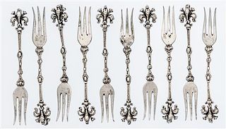 * Ten German Silver Cocktail Forks Length 3 5/8 inches.