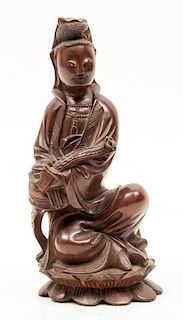 A Wood Figure of a Guanyin Height 9 1/2 inches.