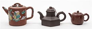 Three Yixing Pottery Teapots Diameter of largest 4 inches.