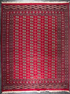 A Bokhara Wool Rug 10 feet 3 inches x 8 feet 3 inches.