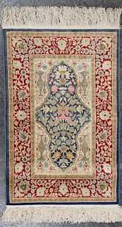 * A Persian Silk and Wool Mat 2 feet 6 inches x 1 foot 7 inches.