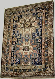 late 19th c Kazak 2 medallion area rug, areas of uneven wear, 3' 2” x 4' 2” late 19th c Kazak 2 meda